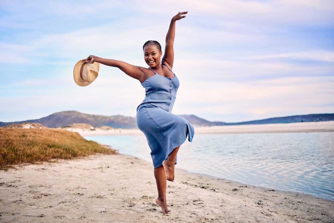 woman dancing on beach