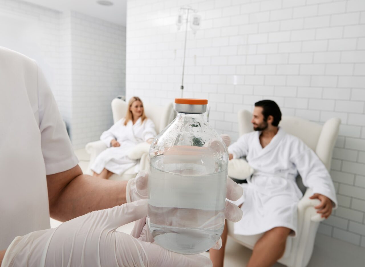 Couple receiving NAD+ IV therapy