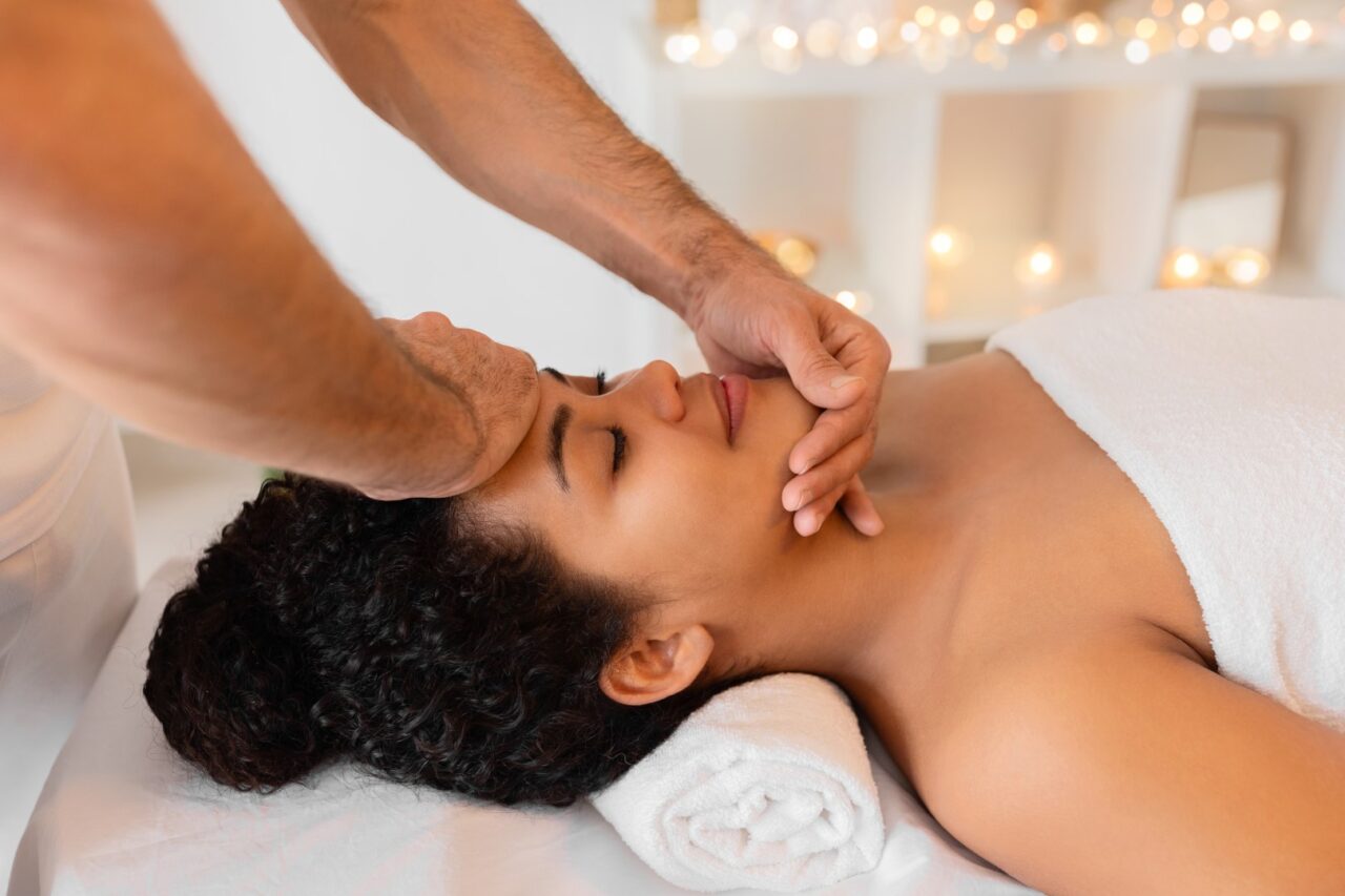 woman receiving face massage