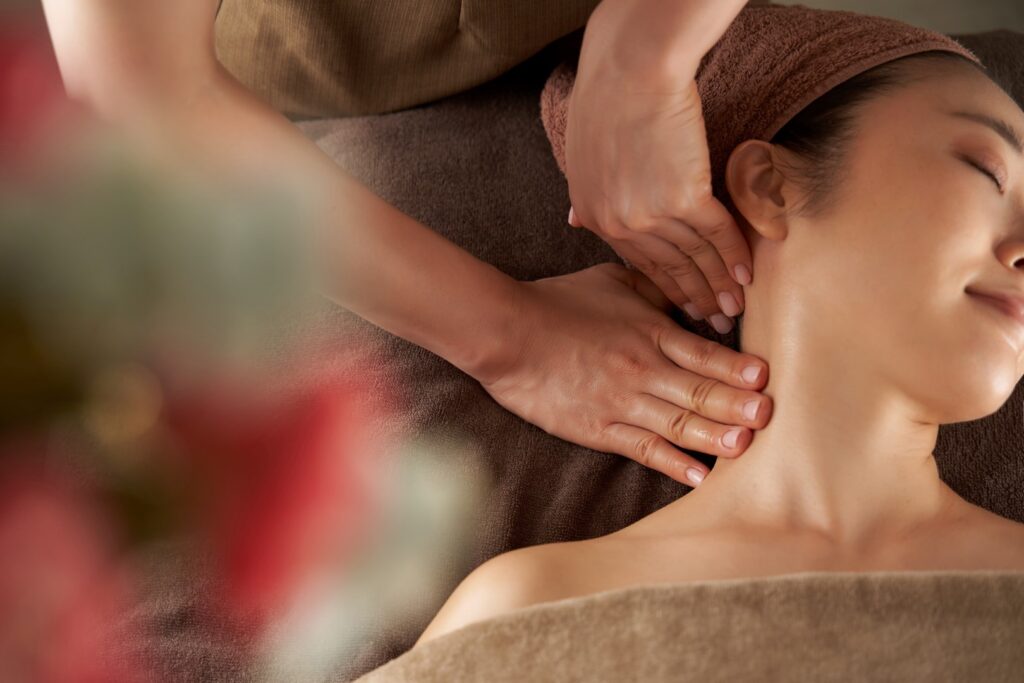 woman receiving neck massage